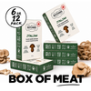 Six boxes of Italian plant-based ground meat arranged in a studio composition with decorative mushroom clusters around them. A black circular badge in the top left reads '6 or 12 pack'.