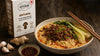 Spicy vegan ramen with creamy sesame-miso broth, chili oil, bok choy and crispy plant-based ground beside The Better Butchers Natural
